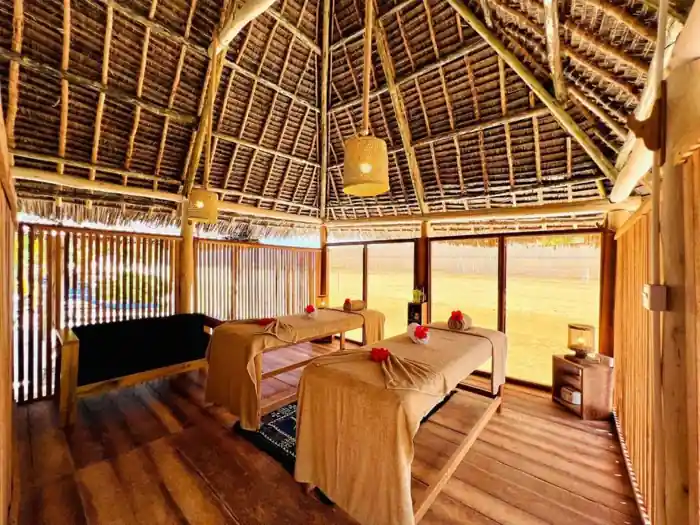 Treatment beds beneath a thatched roof